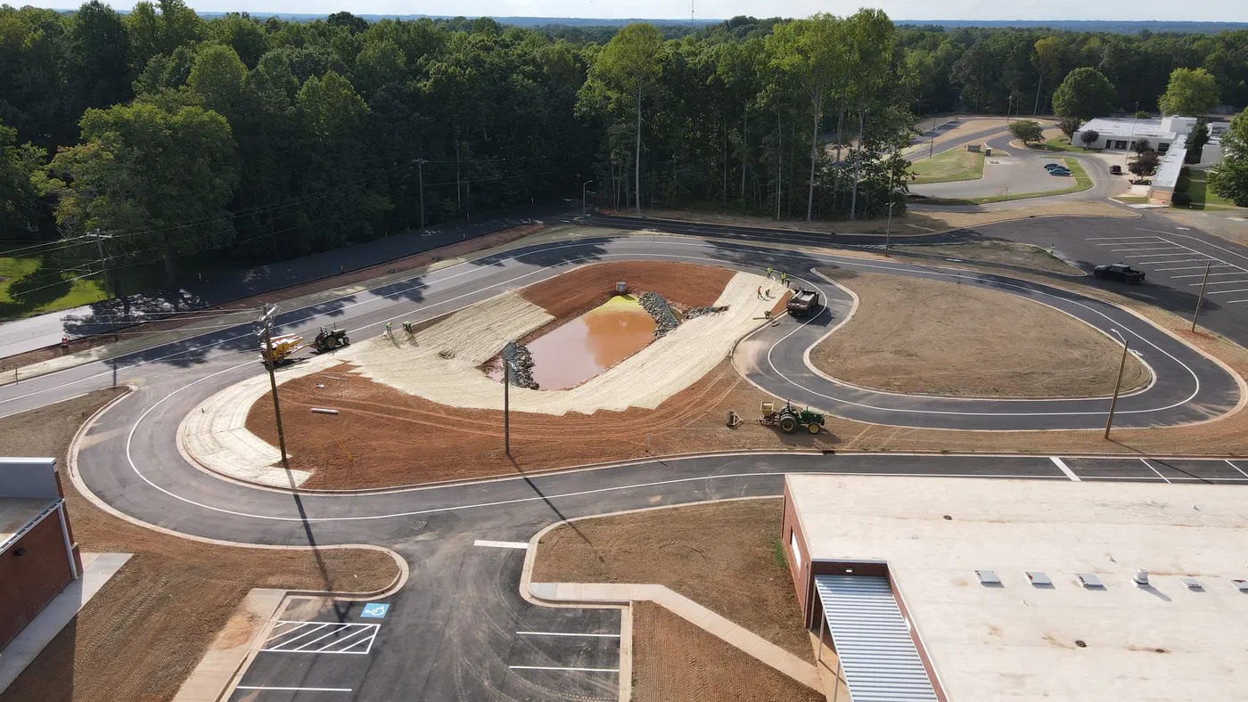 Aerial view of retention pond and erosion control work on a J. Coble sitework project
